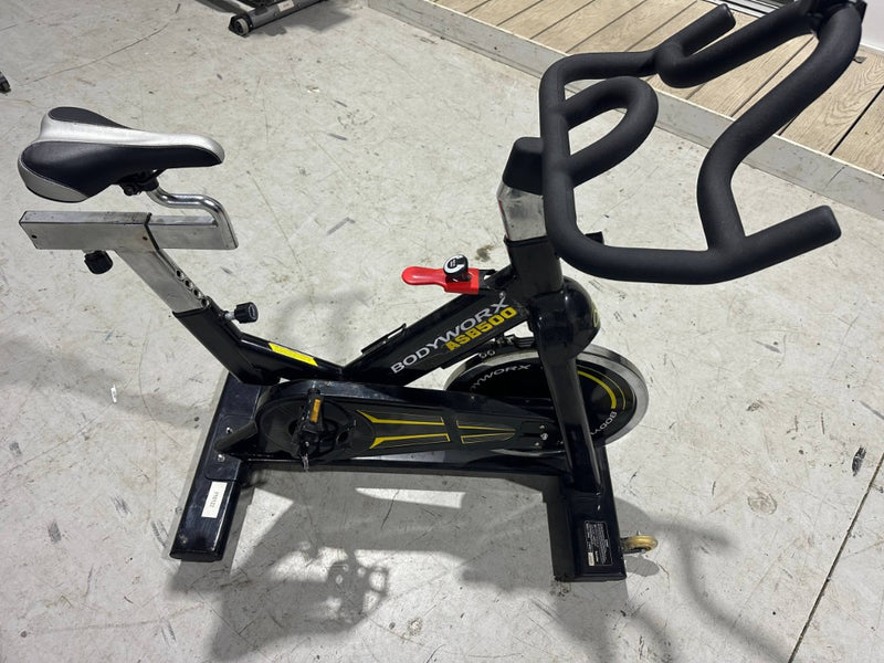 Bodyworx ASB500 ex-hire spin bike handlebars and flywheel side view Melbourne